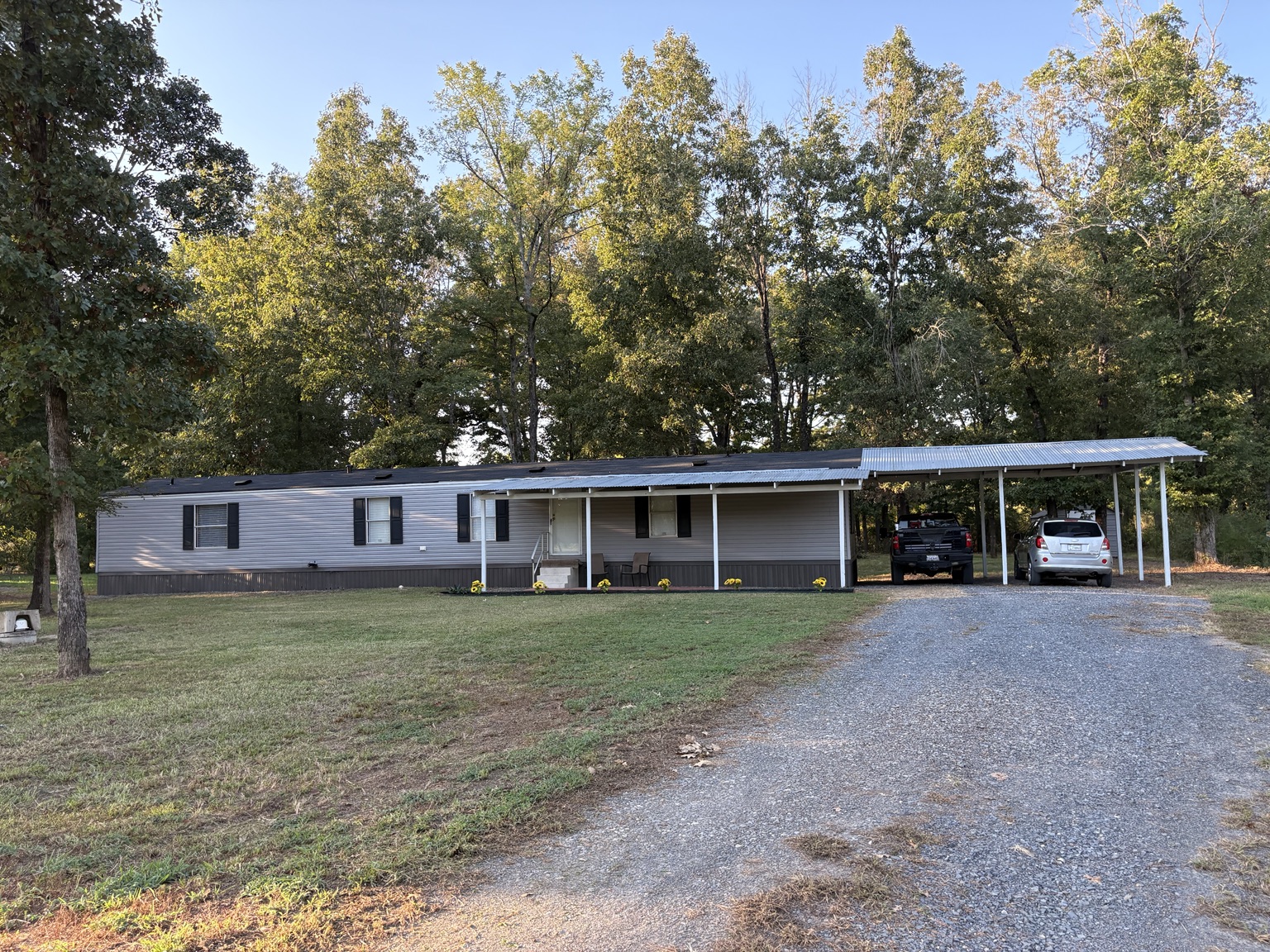 Mobile home with covered parking